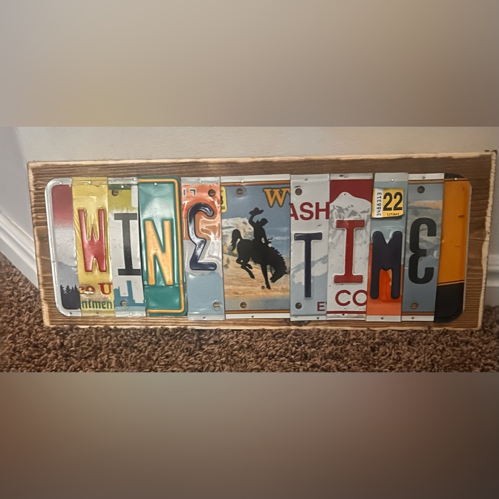 Cute one of a kind sign made from old license plates.